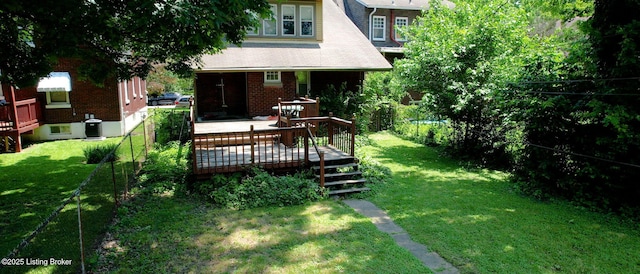1344 S Brook St, Louisville, KY 40208 - view of green lawn with a wooden deck