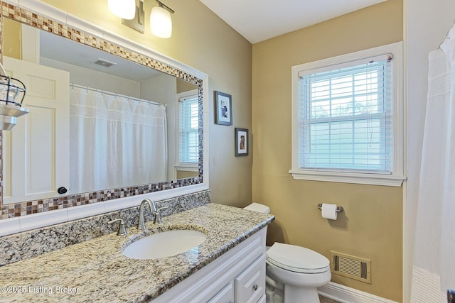 1007 Girard Dr, Louisville, KY 40222 - bathroom with vanity, toilet, and baseboards