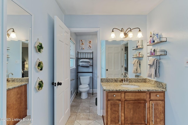 1007 Girard Dr, Louisville, KY 40222 - bathroom with vanity, toilet, tile patterned floors, and baseboards