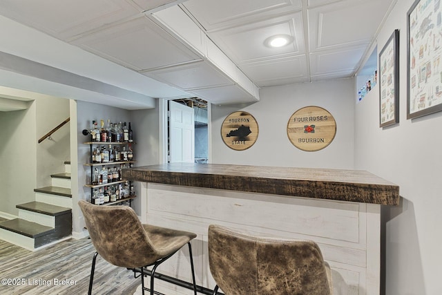 1007 Girard Dr, Louisville, KY 40222 - indoor dry bar featuring stairway, wood finished floors, and baseboards