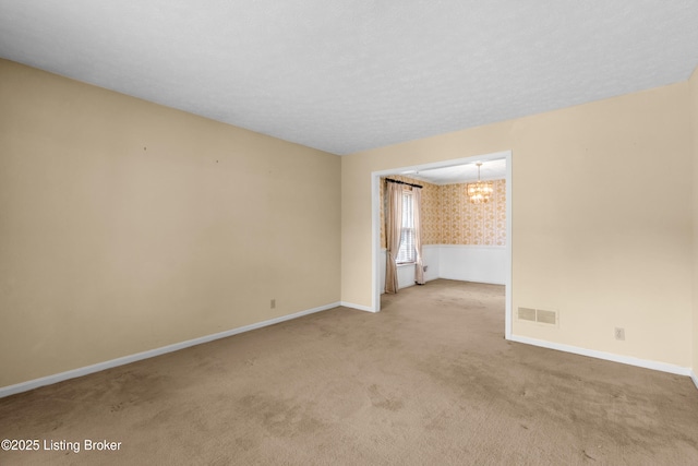 7509 Appletree Way, Louisville, KY 40228 - spare room with carpet, a chandelier, and wallpapered walls