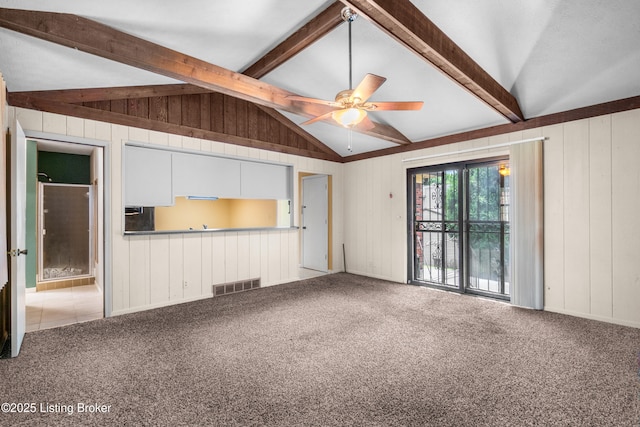7509 Appletree Way, Louisville, KY 40228 - unfurnished living room featuring carpet, wooden walls, and a ceiling fan