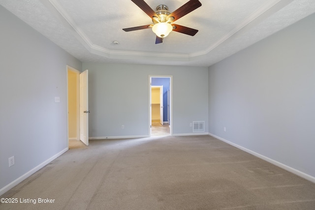 8811 Eli Dr, Louisville, KY 40291 - empty room with a tray ceiling, a ceiling fan, carpet flooring, baseboards, and ornamental molding