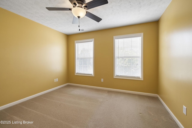 8811 Eli Dr, Louisville, KY 40291 - spare room featuring light colored carpet, baseboards, a textured ceiling, and a ceiling fan