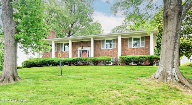 2508 Windsor Forest Dr, Louisville, KY 40272 - raised ranch featuring a chimney, brick siding, and a front lawn