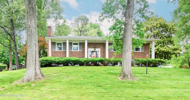 2508 Windsor Forest Dr, Louisville, KY 40272 - split foyer home with brick siding, a chimney, and a front yard