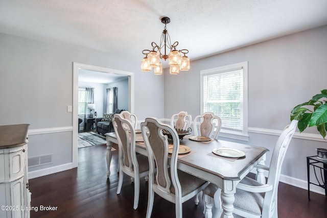 2508 Windsor Forest Dr, Louisville, KY 40272 - dining space with dark wood finished floors, a chandelier, and baseboards