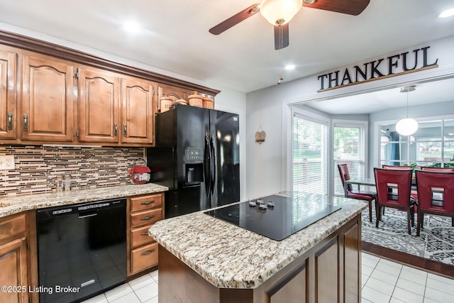 2508 Windsor Forest Dr, Louisville, KY 40272 - kitchen with black appliances, light tile patterned floors, decorative backsplash, a ceiling fan, and a kitchen island