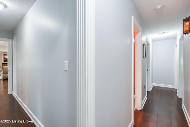 2508 Windsor Forest Dr, Louisville, KY 40272 - hallway with dark wood-style floors and baseboards
