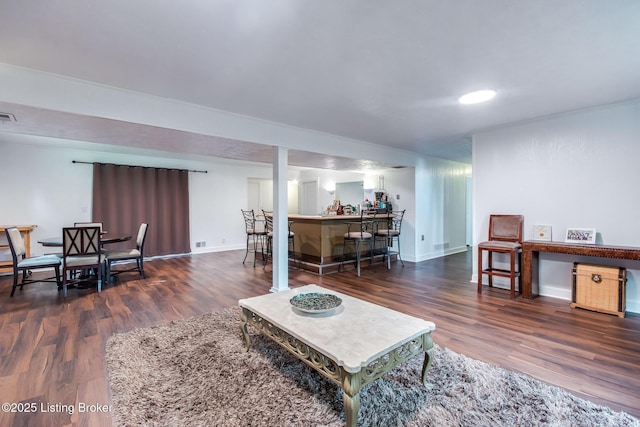 2508 Windsor Forest Dr, Louisville, KY 40272 - living area with wood finished floors, bar, and baseboards