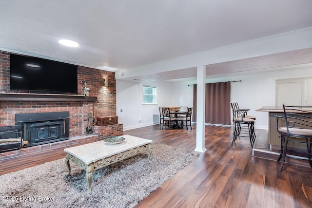 2508 Windsor Forest Dr, Louisville, KY 40272 - living room with baseboards, wood finished floors, and a brick fireplace