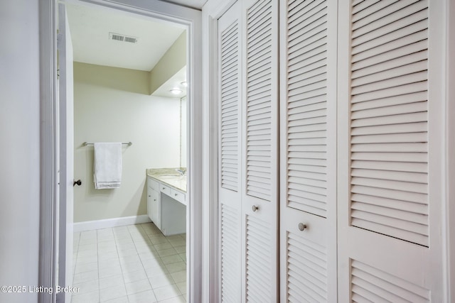 2508 Windsor Forest Dr, Louisville, KY 40272 - bathroom featuring a closet, vanity, baseboards, and tile patterned flooring