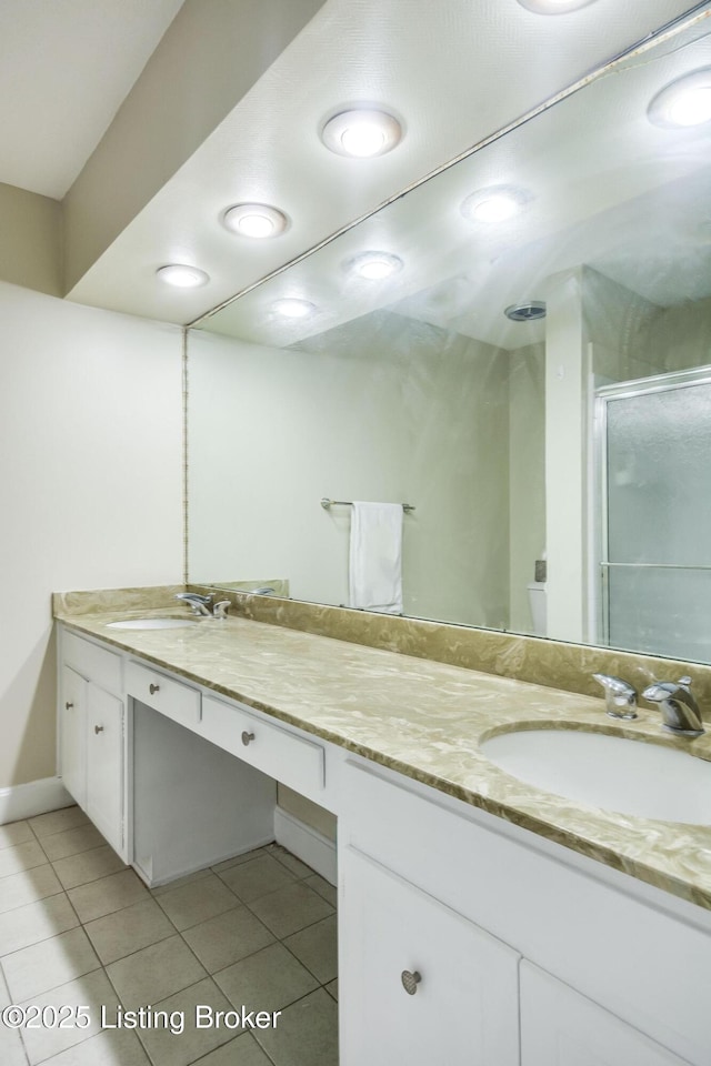 2508 Windsor Forest Dr, Louisville, KY 40272 - full bathroom with tile patterned floors, double vanity, a stall shower, and baseboards