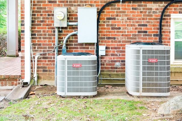 2508 Windsor Forest Dr, Louisville, KY 40272 - exterior view of central AC, brick siding, and electric meter