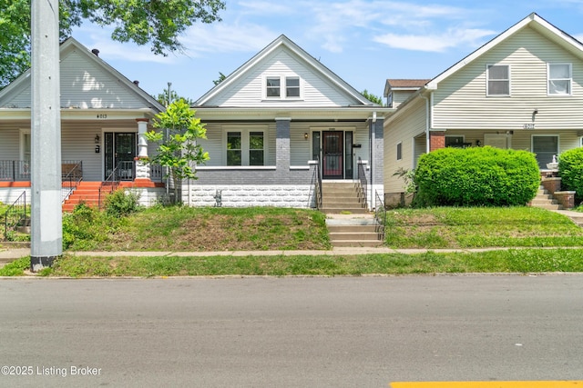 4015 S 5th St, Louisville, KY 40214 - view of front of property featuring covered porch, brick siding, and stairs
