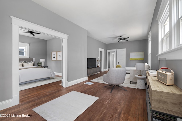4015 S 5th St, Louisville, KY 40214 - living area featuring a ceiling fan, wood finished floors, and baseboards
