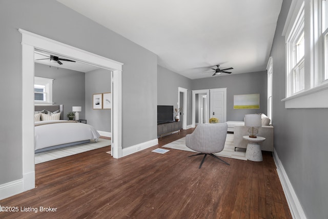 4015 S 5th St, Louisville, KY 40214 - bathroom featuring a ceiling fan, wood finished floors, and baseboards