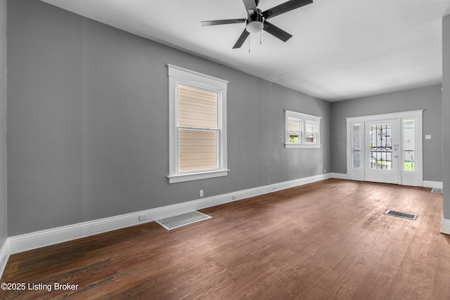 4015 S 5th St, Louisville, KY 40214 - unfurnished room with wood finished floors, baseboards, and a ceiling fan