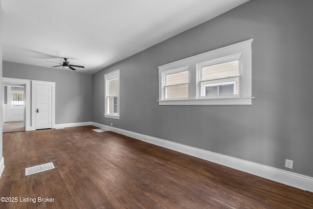 4015 S 5th St, Louisville, KY 40214 - unfurnished room featuring ceiling fan, baseboards, healthy amount of natural light, and dark wood-style flooring