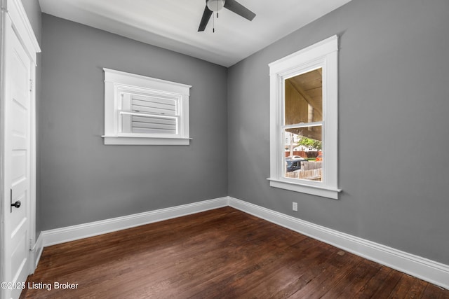 4015 S 5th St, Louisville, KY 40214 - unfurnished room with ceiling fan, dark wood-type flooring, and baseboards