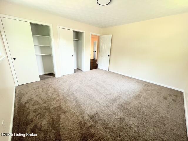 7402 Nottoway Cir, Louisville, KY 40214 - unfurnished bedroom with multiple closets and carpet