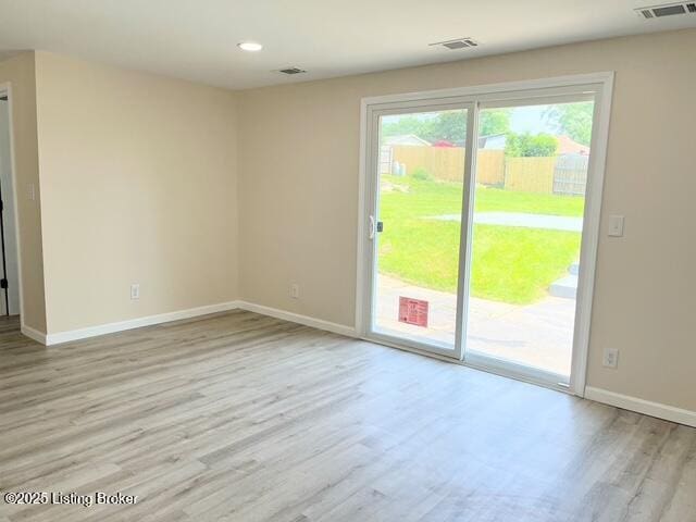 7402 Nottoway Cir, Louisville, KY 40214 - empty room with healthy amount of natural light, light wood-type flooring, and recessed lighting