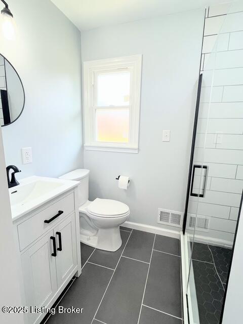 7402 Nottoway Cir, Louisville, KY 40214 - full bath with vanity, a stall shower, and tile patterned flooring