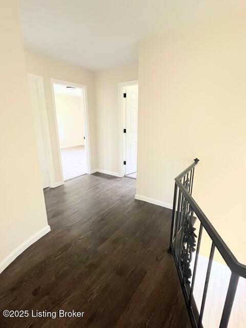 7402 Nottoway Cir, Louisville, KY 40214 - hallway with an upstairs landing and dark wood finished floors