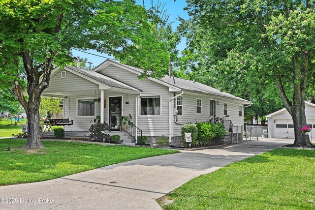 9712 Keys Ferry Rd, Fairdale, KY 40118 - view of front of house featuring an outdoor structure, a front yard, and a garage