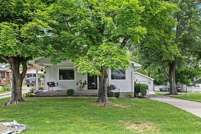9712 Keys Ferry Rd, Fairdale, KY 40118 - view of property hidden behind natural elements featuring a porch and concrete driveway