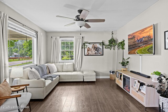 9712 Keys Ferry Rd, Fairdale, KY 40118 - living room featuring dark wood-style flooring, ceiling fan, and baseboards