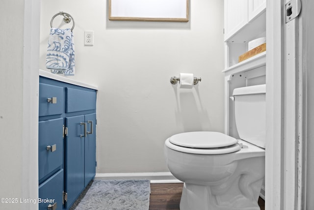 9712 Keys Ferry Rd, Fairdale, KY 40118 - half bathroom featuring baseboards, toilet, and wood finished floors