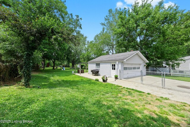 9712 Keys Ferry Rd, Fairdale, KY 40118 - view of yard with a detached garage and an outbuilding