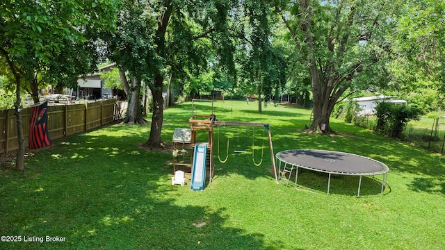9712 Keys Ferry Rd, Fairdale, KY 40118 - view of yard with a trampoline and a playground