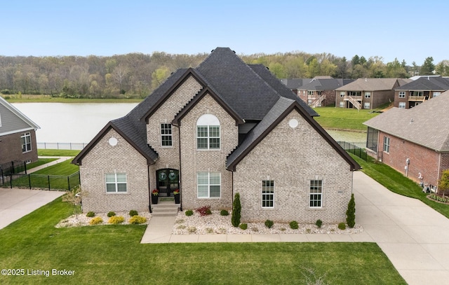 2004 Scenic Lakes Dr, Louisville, KY 40245 - view of front of house with brick siding, a water view, and a shingled roof