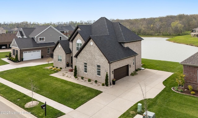 2004 Scenic Lakes Dr, Louisville, KY 40245 - view of front of property with concrete driveway, brick siding, a water view, a garage, and a front lawn