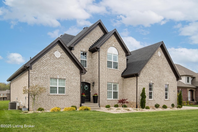 2004 Scenic Lakes Dr, Louisville, KY 40245 - view of front of property with brick siding, a front yard, and a shingled roof