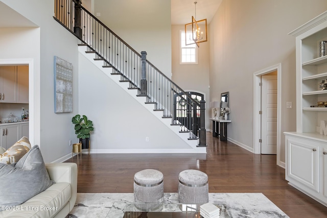 2004 Scenic Lakes Dr, Louisville, KY 40245 - foyer entrance with a towering ceiling, dark wood-style flooring, a chandelier, baseboards, and stairs