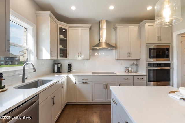 2004 Scenic Lakes Dr, Louisville, KY 40245 - kitchen featuring stainless steel appliances, wall chimney exhaust hood, a sink, dark wood finished floors, and backsplash