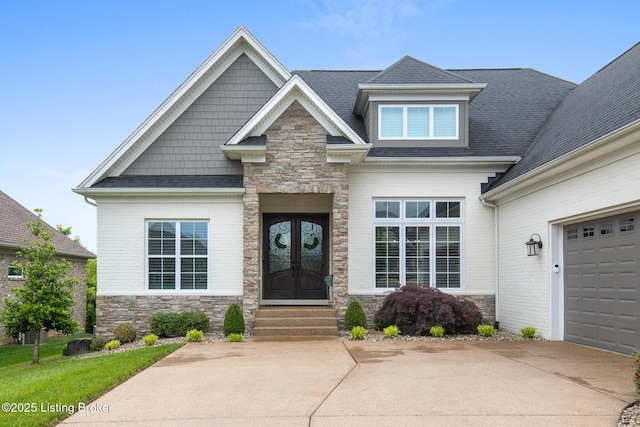 14829 Ava Brook Cir, Louisville, KY 40245 - view of front of house featuring stone siding, entry steps, roof with shingles, and concrete driveway