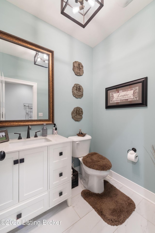 14829 Ava Brook Cir, Louisville, KY 40245 - bathroom featuring toilet, vanity, marble look tile flooring, and baseboards