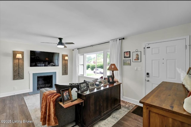 4523 Blenheim Rd, Louisville, KY 40207 - living area with wood finished floors, a fireplace with flush hearth, ceiling fan, and baseboards