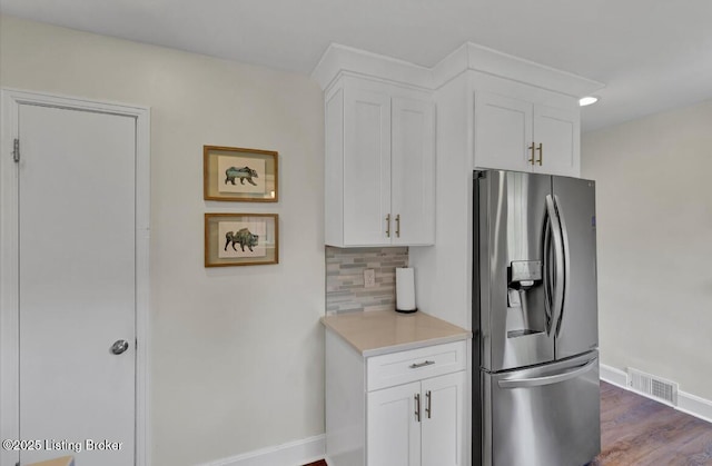 4523 Blenheim Rd, Louisville, KY 40207 - kitchen featuring stainless steel refrigerator with ice dispenser, baseboards, white cabinetry, decorative backsplash, and light countertops