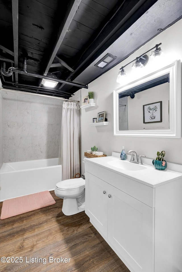 4523 Blenheim Rd, Louisville, KY 40207 - full bathroom featuring vanity, toilet, wood finished floors, and shower / bath combo with shower curtain