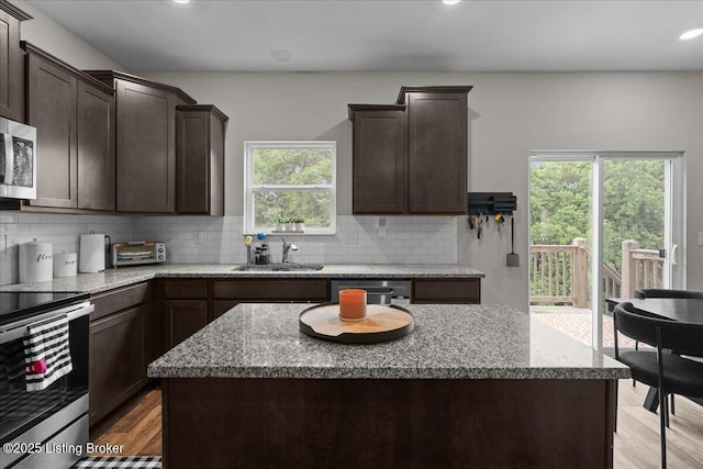 1105 Johnson Ridge Rd, Louisville, KY 40245 - kitchen featuring a sink, stainless steel appliances, dark brown cabinets, light stone countertops, and recessed lighting