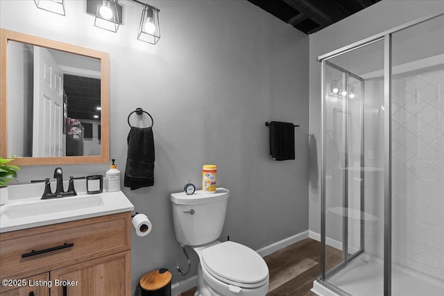 1105 Johnson Ridge Rd, Louisville, KY 40245 - bathroom featuring vanity, toilet, a shower stall, wood finished floors, and baseboards