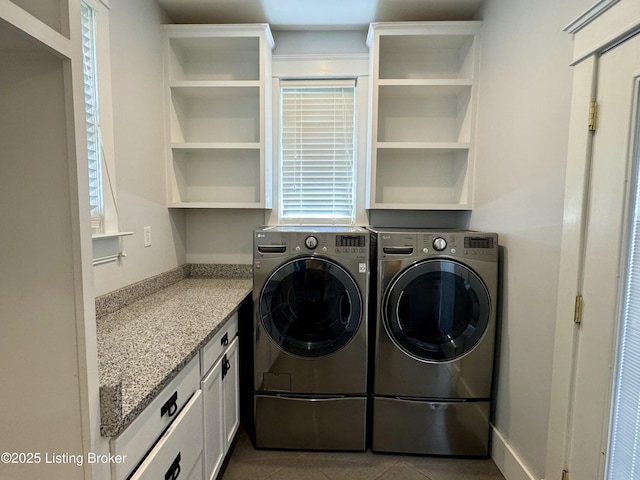4107 Southern Pkwy, Louisville, KY 40214 - laundry room with washing machine and clothes dryer, healthy amount of natural light, and tile patterned flooring