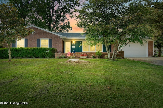 7007 Graymoor Rd, Louisville, KY 40222 - view of front facade with brick siding, concrete driveway, a front lawn, and a garage