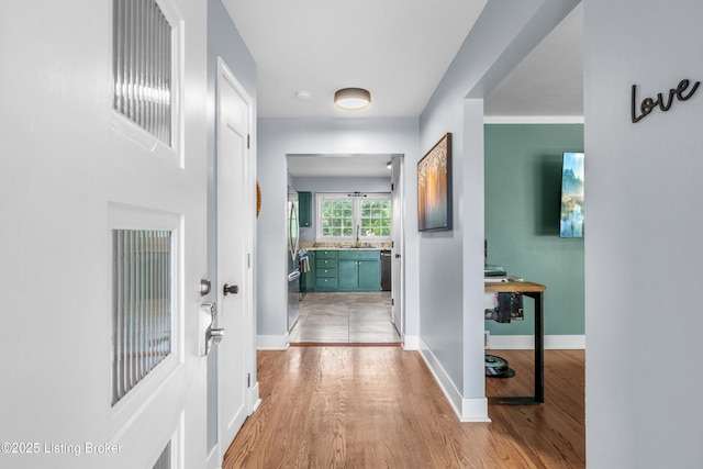 7007 Graymoor Rd, Louisville, KY 40222 - hall featuring light wood-style flooring, a sink, and baseboards