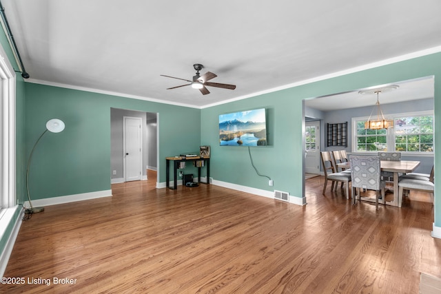 7007 Graymoor Rd, Louisville, KY 40222 - living area featuring light wood-type flooring, a ceiling fan, baseboards, and crown molding